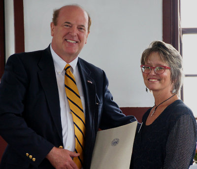 Representative David Campbell presents Governor Hassan's proclamation to Sharon Kennedy