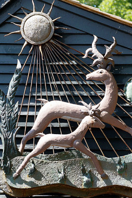 Deer and sun-rays sculpture.