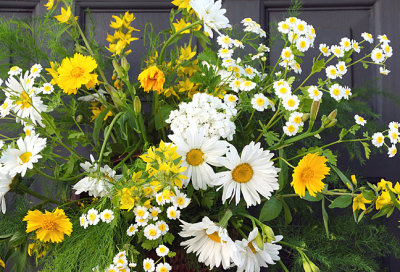 White and yellow flowers basket.