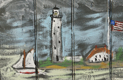 Painted lighthouse on fencing.