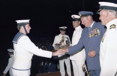 Me accepting 2 Echo Class Marching and Parade Prize, Graduation March 1977