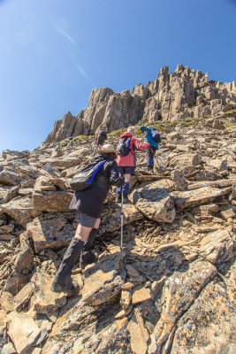 Approaching the summit, the climb becomes a scramble over broken rocks