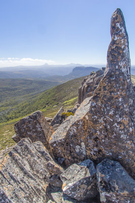 Pelion East gives us the dolerite finger. Barn Bluff and Cradle Mountain can still be just made out in the far distance