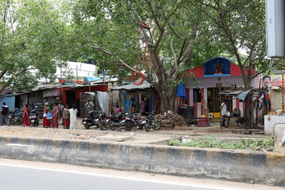 A small village on the opposite side of the road to a shopping centre