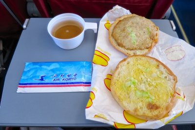 Hamburger and tea on board Air Koryo
