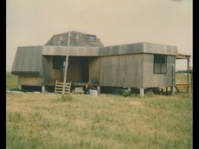 These four photos are Polaroids that Mary thinks were taken by an assessor, perhaps someone from whom we hoped to get a loan for the second dome. This shot is from the southwest, looking northeast, at the front porch and kitchen extension.