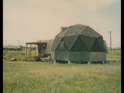 This assessor's Polaroid was taken from the northeast corner of the lot, looking southwest. Our former neighbors Susan and Phil called our little dome The Jewel on the Prairie. Pam S sent us a cross-stitch of a dome with the label Home Sweet Dome.
 