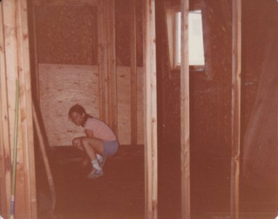 Mary, checking the particle board that was put down for flooring. It got wet and had to be replaced.