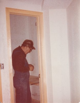 Dad moved on to installing the bathroom door jambs and cabinets.