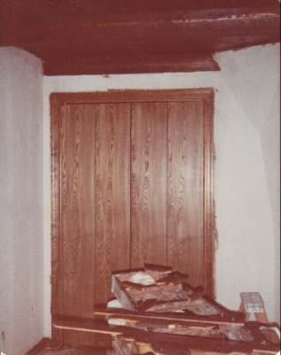 We stained all the woodwork by hand, including the tongue-and-groove ceilings of the downstairs rooms. Sawdust came through the cracks of the tongue-and-groove lumber for years. This is the downstairs bedroom the boys used.