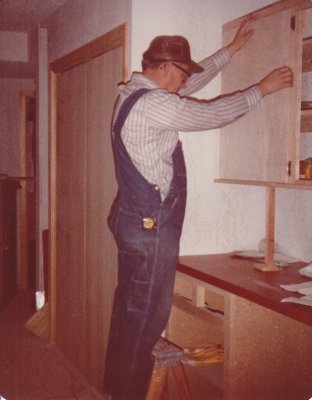 Dad used a jig he had made to set the cabinet doors all the same height.