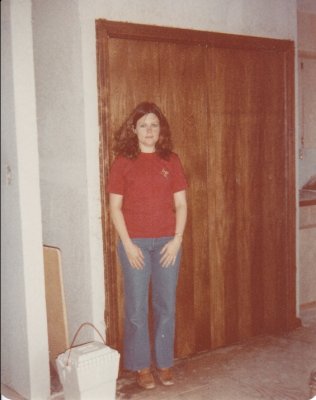 Mary standing proudly by the laundry pantry after staining.