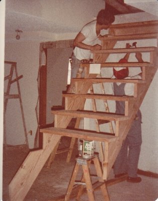 Steve watches while Dad starts installing the staircase to the upstairs loft.