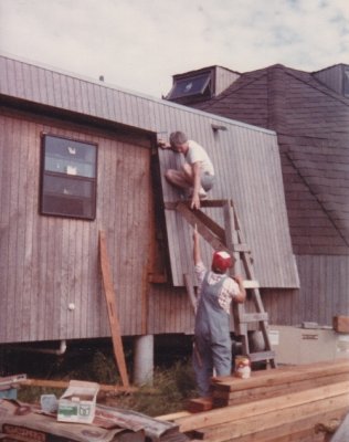 With materials delivered for the back porch, Steve and Dad start construction by closing off the edge of the roof overhang to keep out the elements--and, eventually, squirrels.