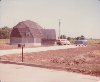 Here's the view of the then-new driveway from the street. Someone gave us the mailbox, already on the post, and we just planted it out front. The skirting around the bottom of the dome has been completed in this shot too.