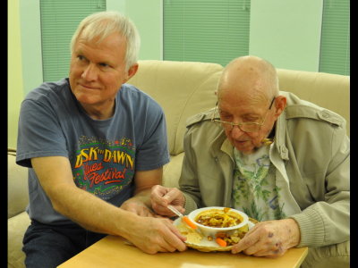 Great-granddad enjoys some chili with an assist from his eldest