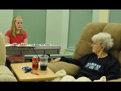 Great-grandma (and the rest of us) watch as Andi plays Over the Rainbow for us.