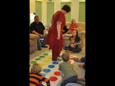 Vicki gets up to show the young ones how Twister is done.