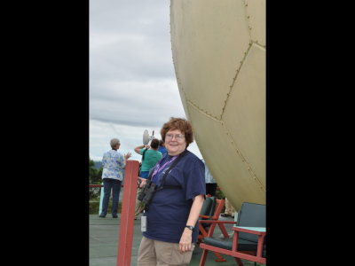 Mary on observation deck next to Canopy Tower dome (how could we not like it!) with Jane, Mia and David in background.
