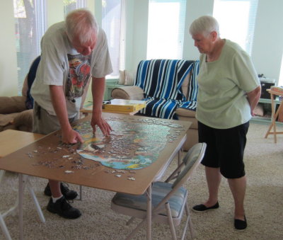 Steve and Jackie take a standing break on the puzzle.
