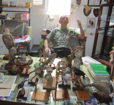 Orlando Garrido, author and naturalist,
among his books and trophies in his office.
Havana, Cuba, March 16, 2016