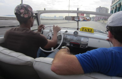 Our driver and Yuri riding along the malecon,
the seawall sidewalk along the water.