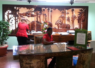 Woodcarvings inside and outside the office at Las Caneyes resort
depict early inhabitants of the area.
