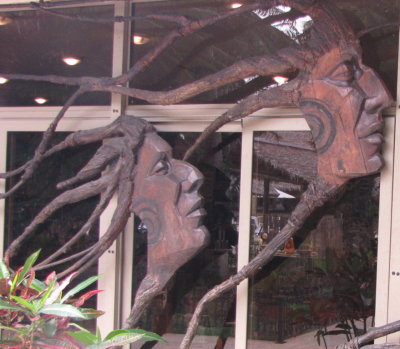 Large woodcarvings across the windows of one of the buildings
