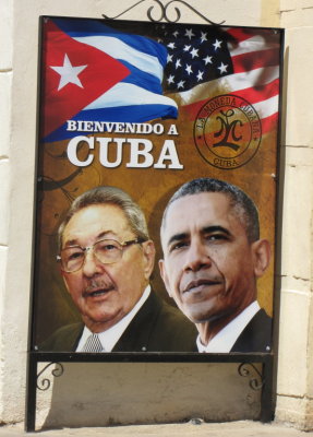 A poster commemorating the historic meeting of Raul Castro and Barak Obama.