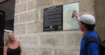 Carli listens as Yuri describes the old aqueduct