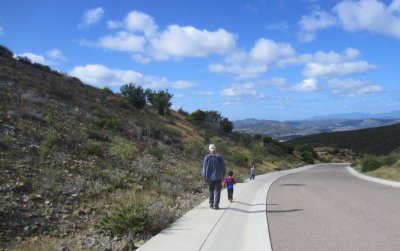 Grandpa and Zeke hiked down the sidewalk.