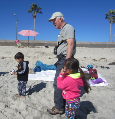 Zeke, Mom, Grandpa and Devon on the beach