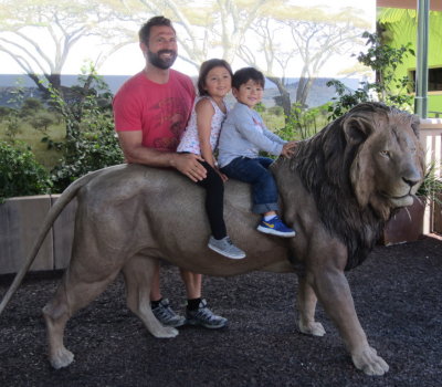 Before we left the zoo, Dad, Devon and Zeke posed for a picture with a lion.