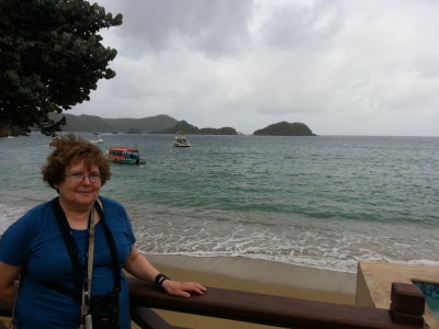 Mary on the deck at Blue Waters Inn
with the Caribbean or Atlantic Ocean in the background