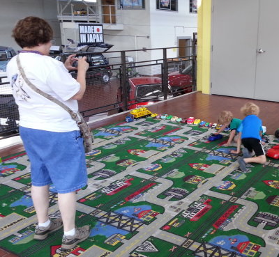 Grandma snaps while Max and Pierce enjoy the big indoor playground.