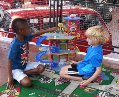 Pierce and a new friend play at the garage. The boys seemed to like the small-car playground at least as much as the big cars.