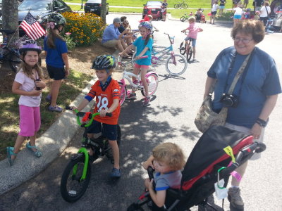 Emma Grace, Savannah, their cousins (in the background), Pierce, Max and Grandma get ready for the parade.