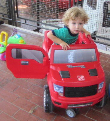 Max climbs into a monster truck.