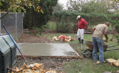 Carlos and his cousin Juan putting the finishing touches on the pad for the south shed.
