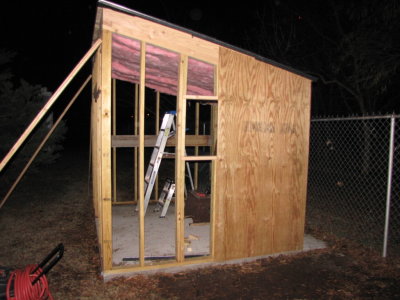 We agreed to put windows in the east, west and south walls and I framed in the space for windows on the south and west walls before putting up the plywood.