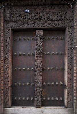 Doors, when building a house they always start with the door, because it indicates the wealth of the owner. The metal picks should avoid the elephants breaking the doors.