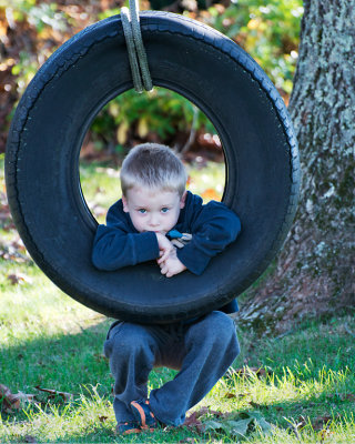 Boy on Tire
