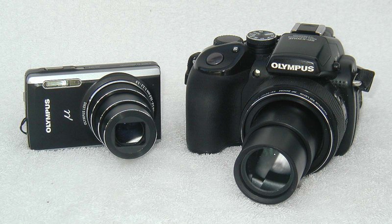 Stylus 9010 (2010) versus SP-570UZ (2008)