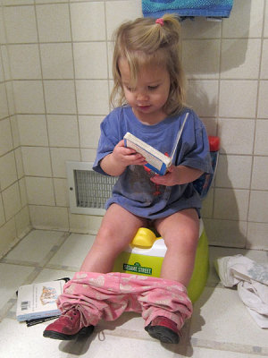 Annie practices on the potty
