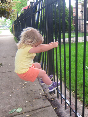 On Aunt Emmy's street, Annie tries to remove fencing.