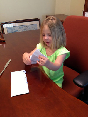 Kristina in Papa's office, sending bills to her clients