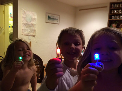 Kids with diodes in dramatic lighting