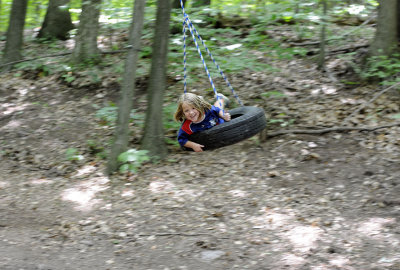 Flying high on the tire swing.
