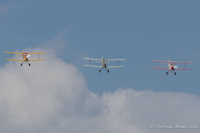 Formation of 3 vintage Stampe biplanes