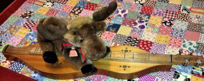 Moose playing dulcimer